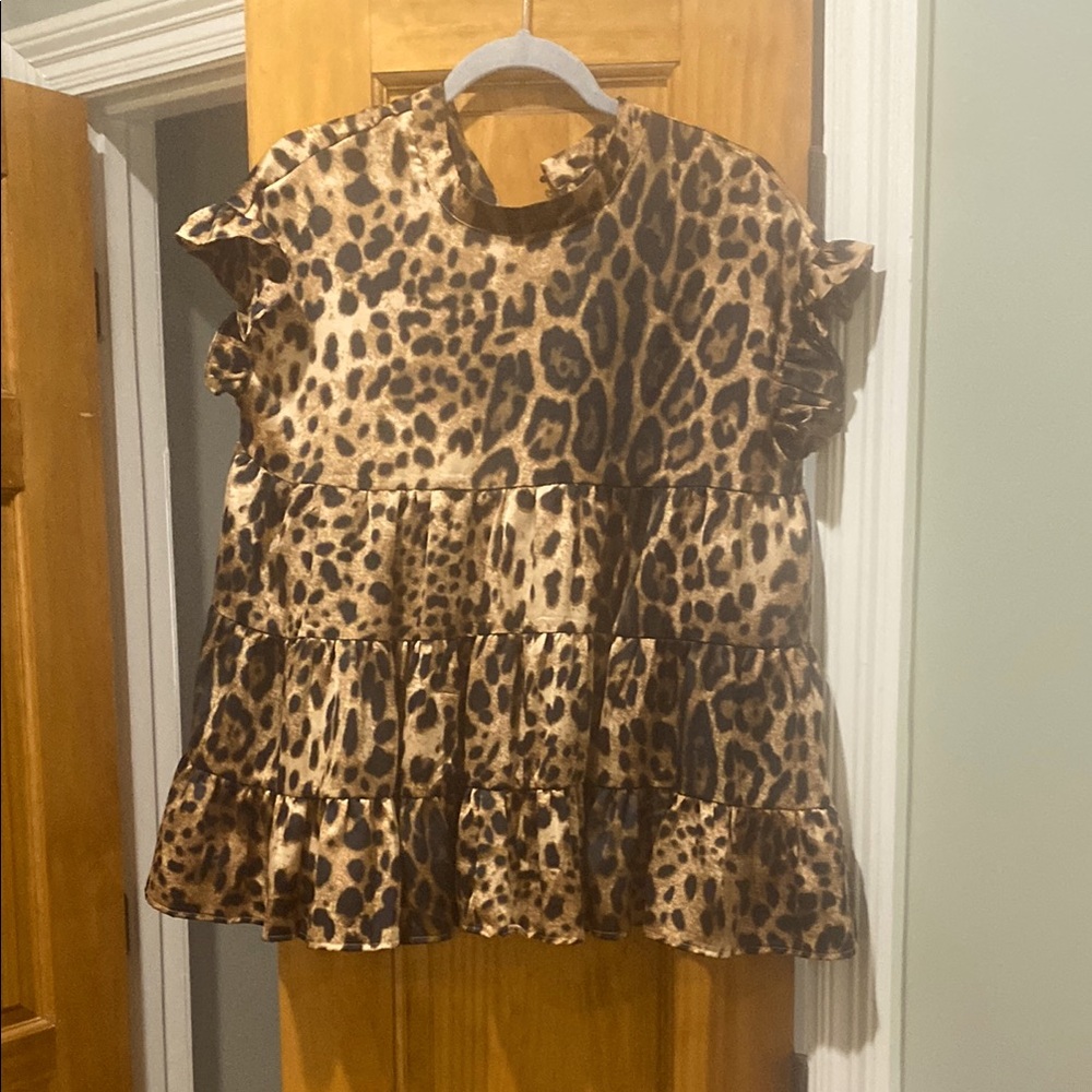 Leopard Print Sleeveless Peplum Top in Brown and Black